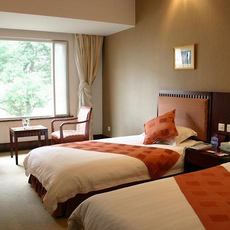 Suzhou Taoyuan International Holiday Hotel Zimmer foto